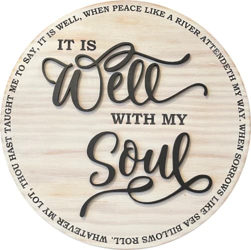 Image of a handcrafted wooden sign that has 'It is well with my soul' lettering on it.