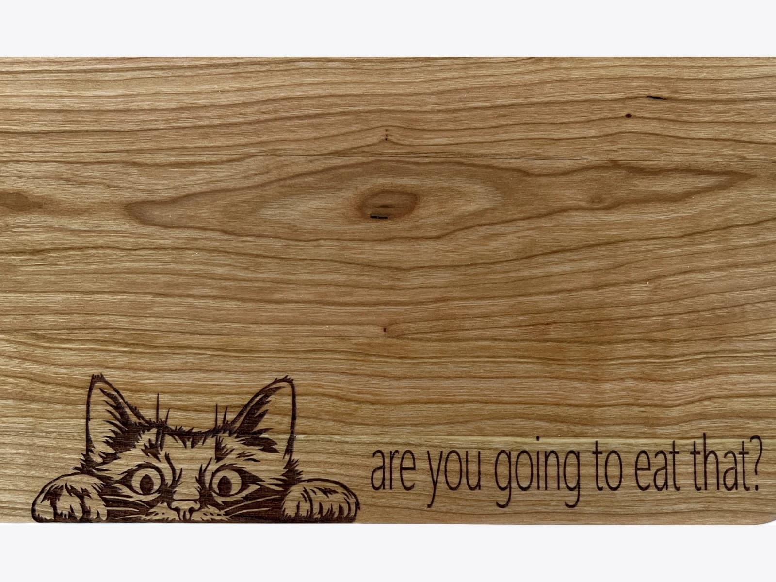 Laser engraved, wooden cutting board with cat design - Are you going to eat that?